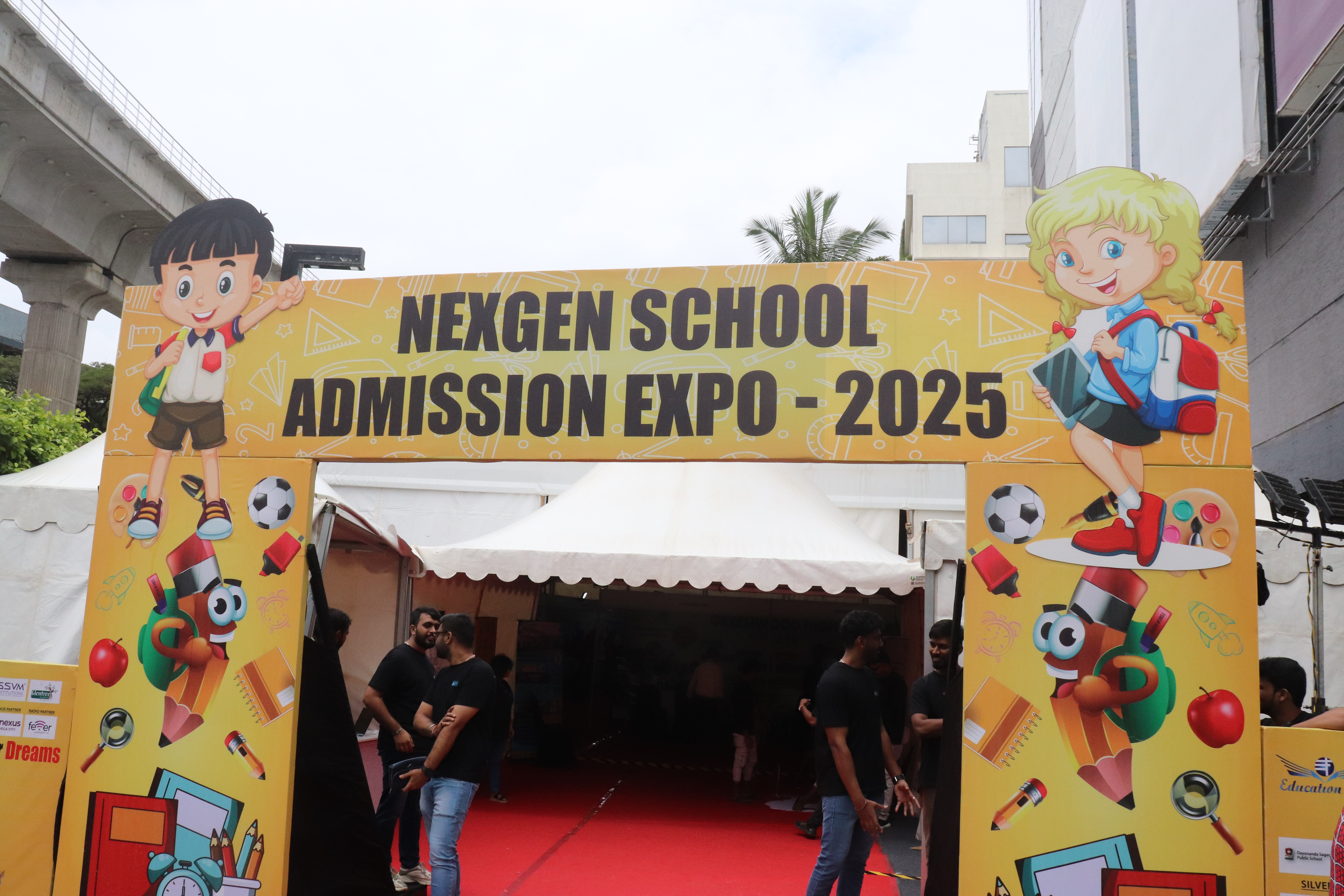 Parents exploring school booths